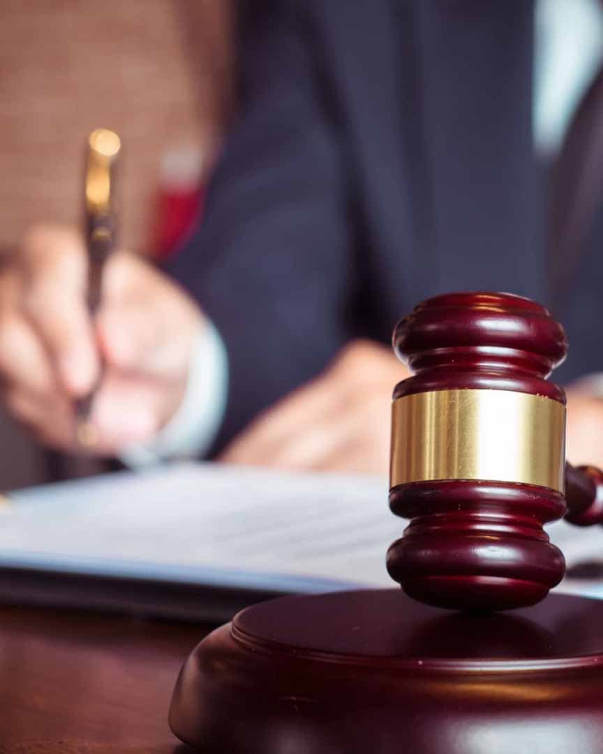 Gavel and legal documents in a courtroom