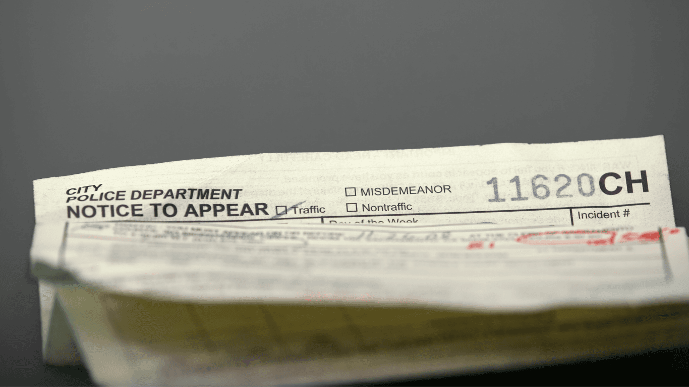 Traffic citation on a vehicle dashboard